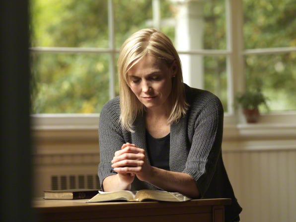 a woman is praying