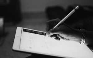 Setting goals and writing them on a planner.