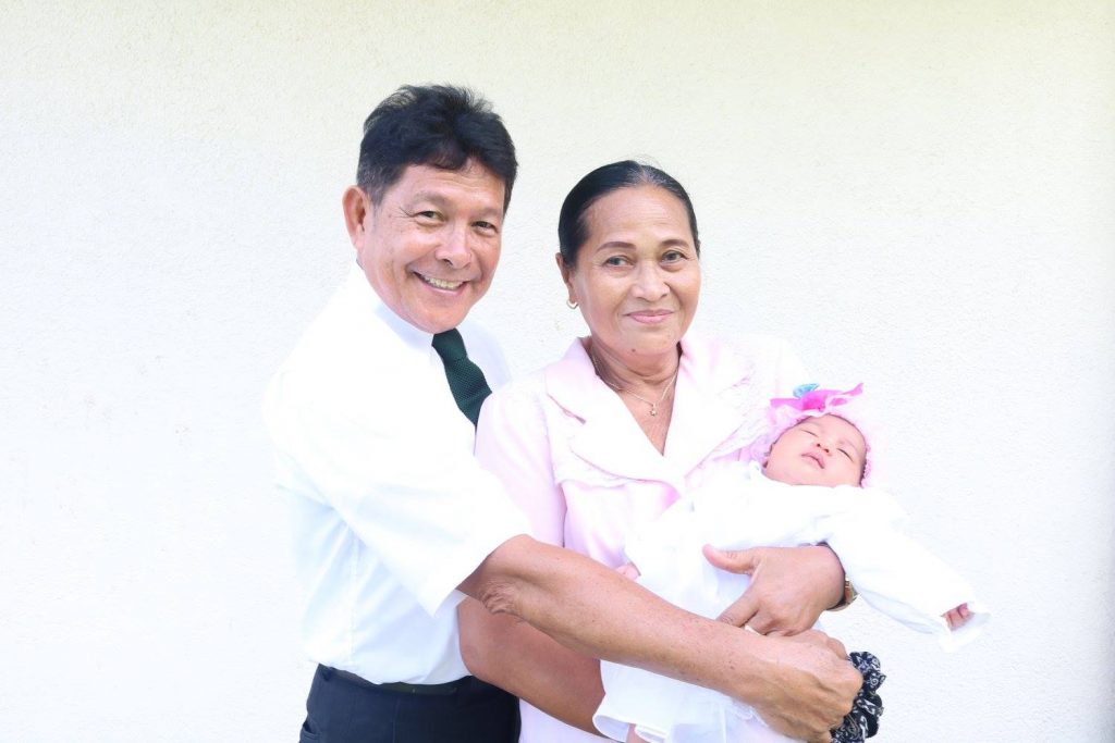 Man and Woman holding a baby