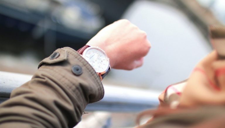 A person looking at her watch.
